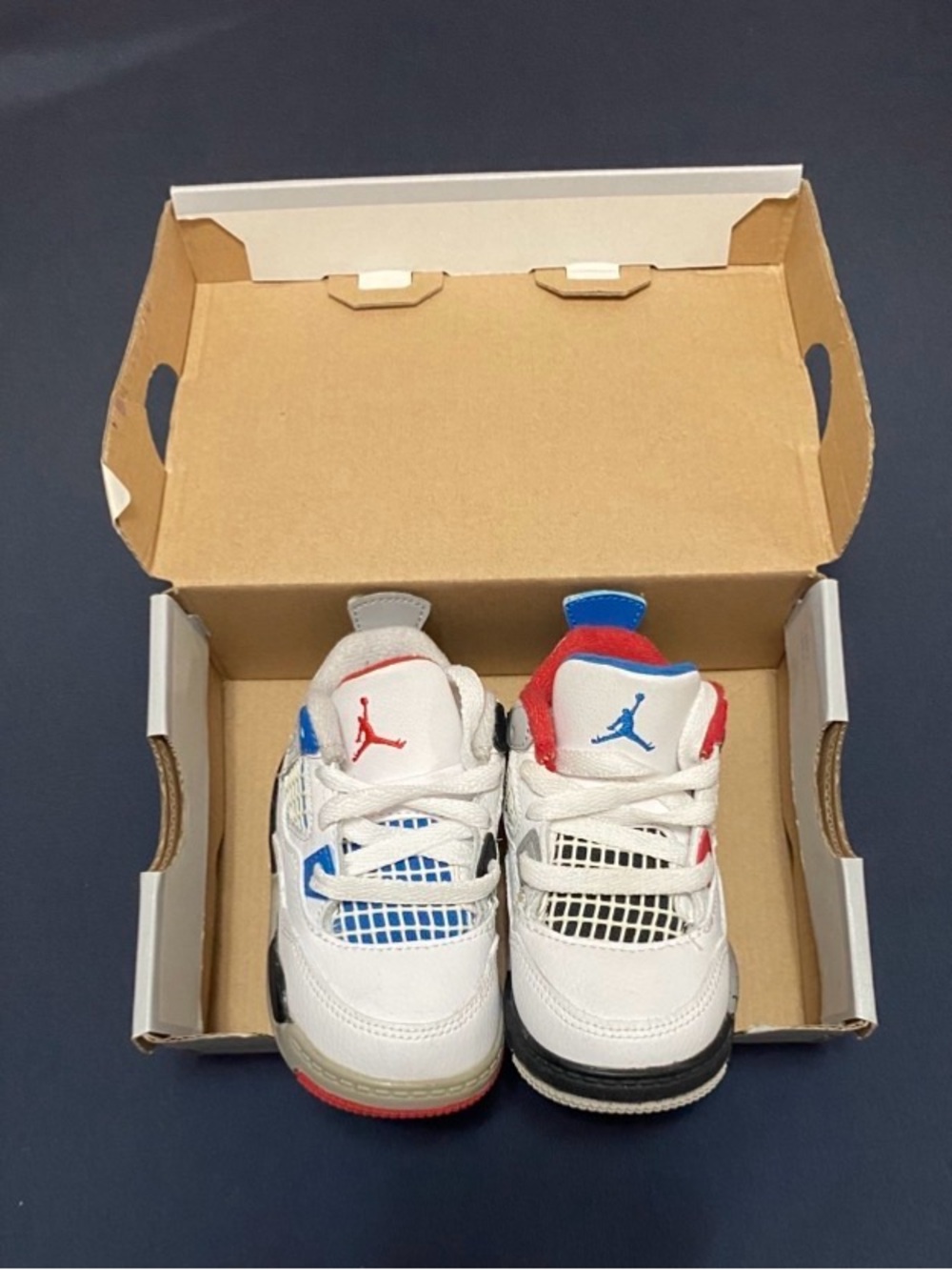 Nike Kids' White Sneakers with Red & Blue Accents